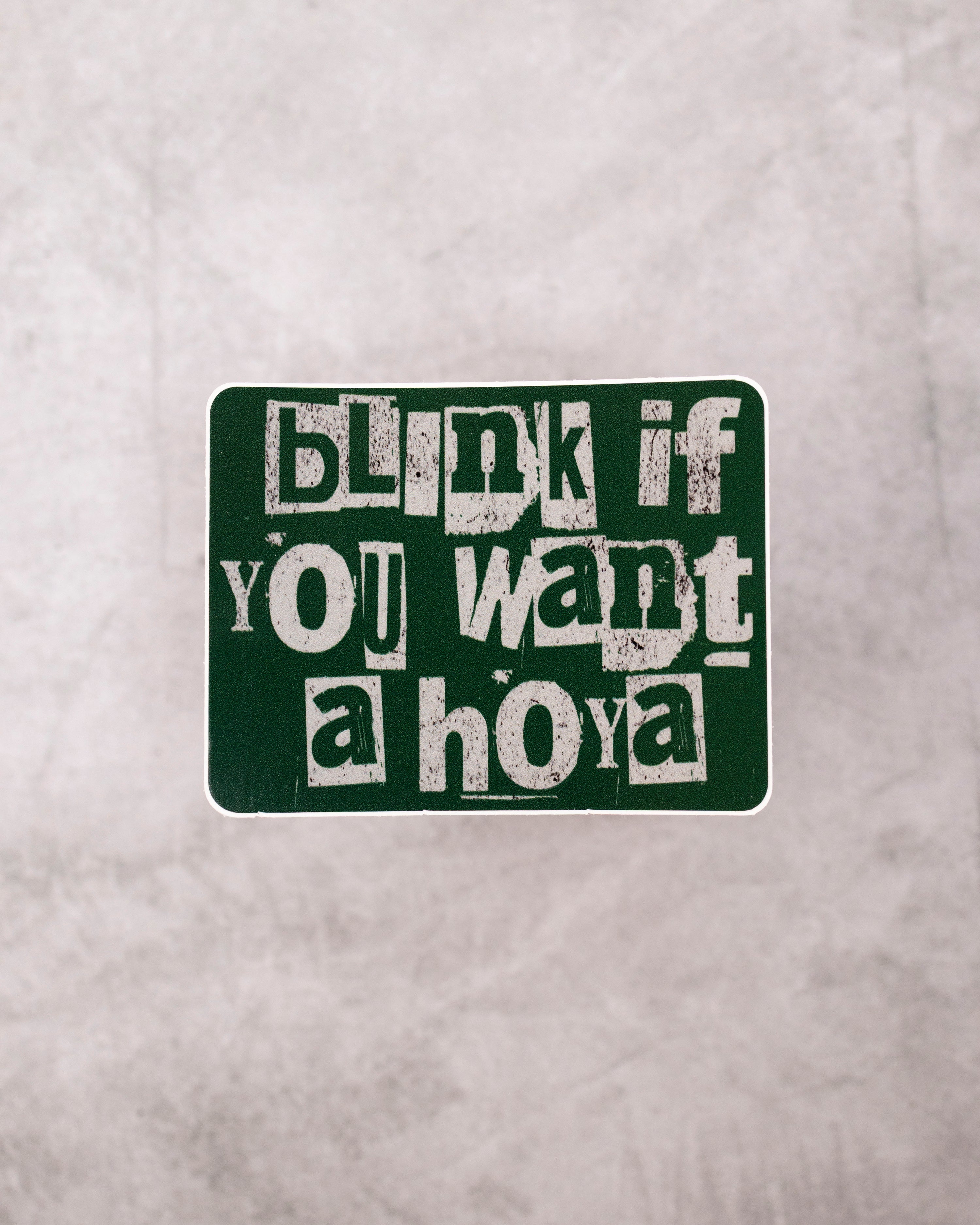 Text sticker on a gray background with &