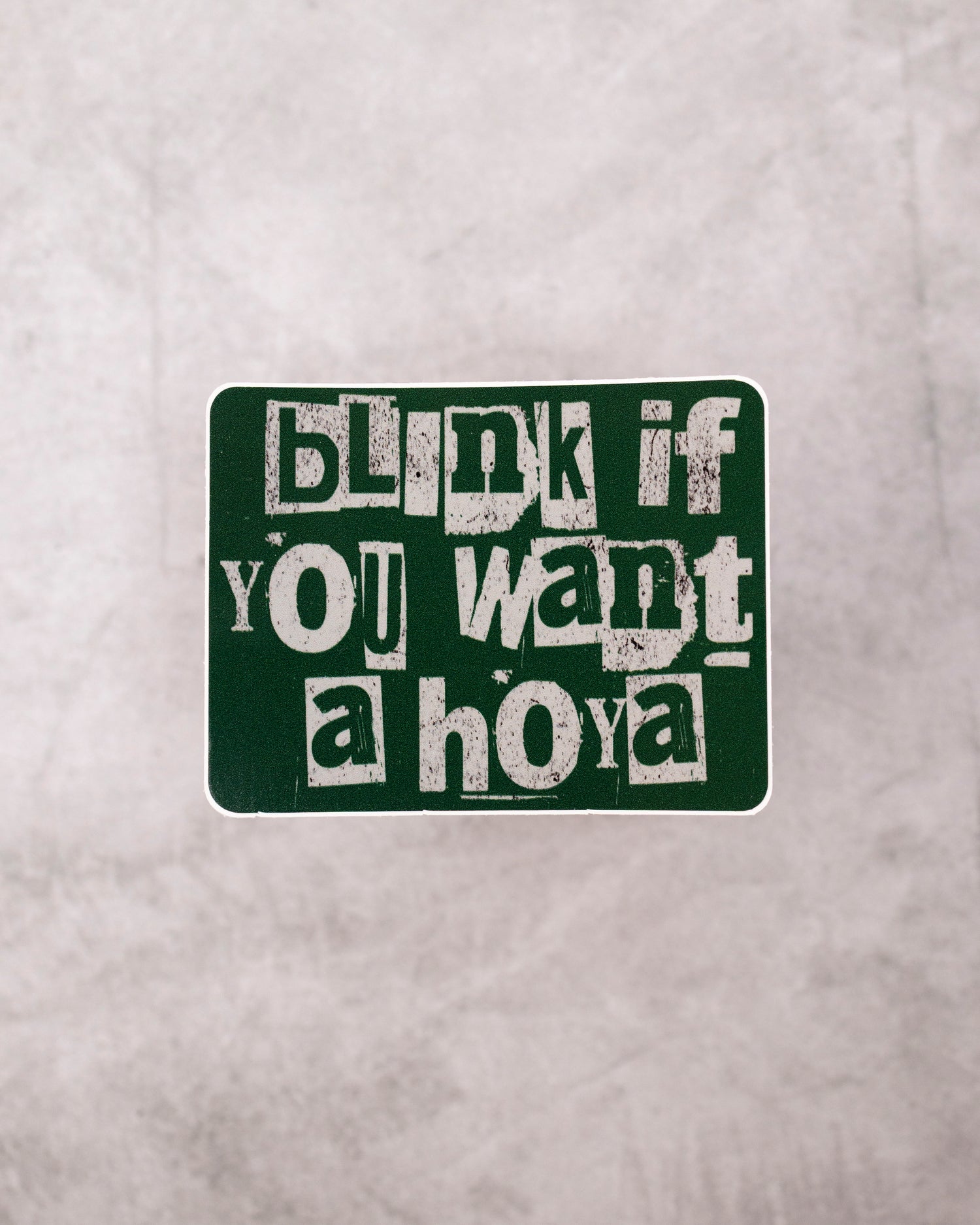 Text sticker on a gray background with &