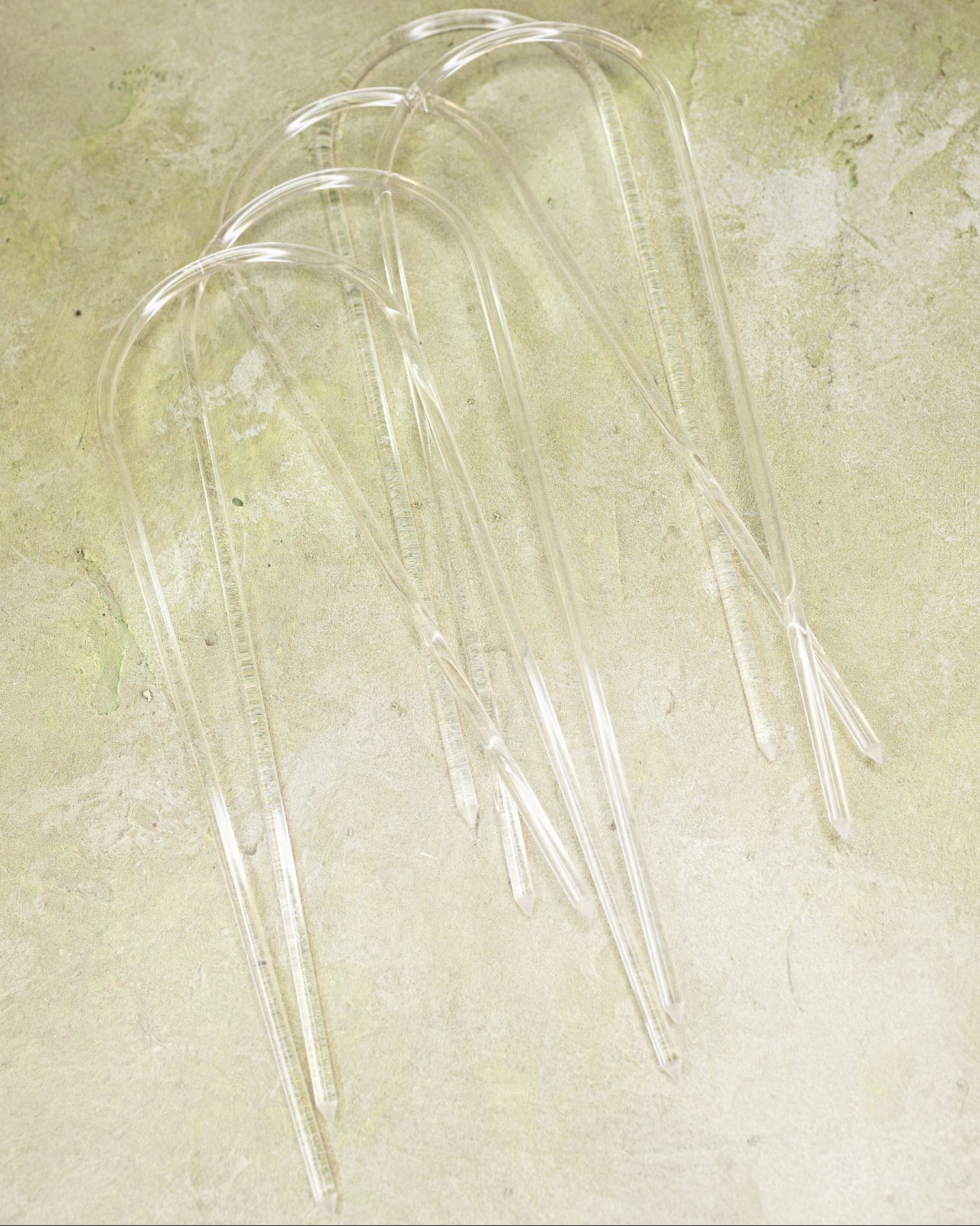 Give clear acrylic trellises on a textured green surface